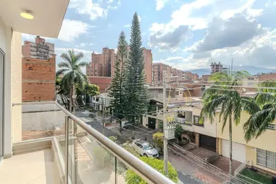 an apartment balcony with a view of a city at Apartamento centrico en Laureles con piscina 301 in Medellín