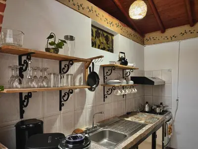 a kitchen with a sink and a counter at Casa Amaru in Guarne