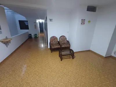 two chairs sitting in a hallway in a building at Hotel El Mirador in San Carlos