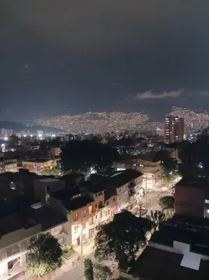 a view of a city at night with lights at Apto tipo Loft en Laureles Nutibara Increíble Vista in Medellín