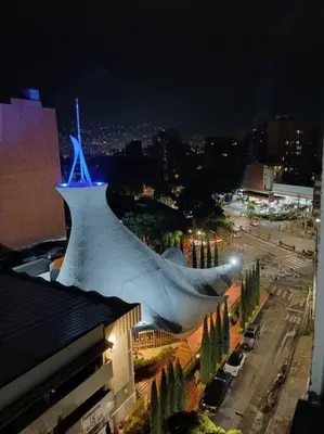 a building with a sculpture of a shark on top of it at Apto tipo Loft en Laureles Nutibara Increíble Vista in Medellín