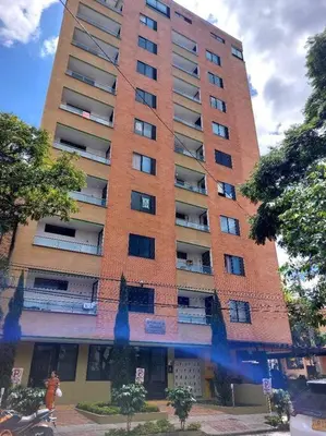 a tall red brick building with at Apto tipo Loft en Laureles Nutibara Increíble Vista in Medellín