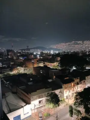 a view of a city at night with lights at Apto tipo Loft en Laureles Nutibara Increíble Vista in Medellín