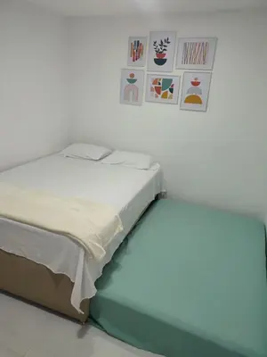 a bed in a room with at Apartaestudio la 70, estadio in Medellín
