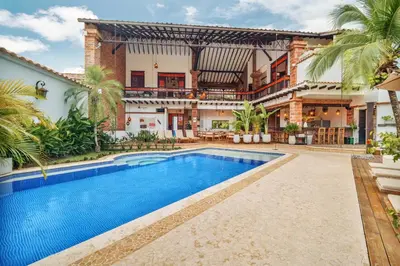 an exterior view of a house with a swimming pool at Casa Linaje Hotel Boutique -Cauca Viejo- Mayores de 10 años in Jericó