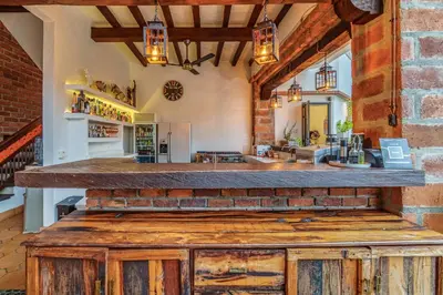 a large kitchen with a counter top in a room at Casa Linaje Hotel Boutique -Cauca Viejo- Mayores de 10 años in Jericó