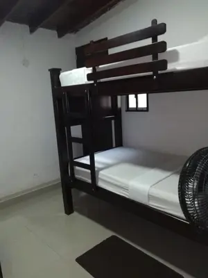 a wooden bunk bed in a room at S3 CÓMODO APARTAMENTO 3 HABI 3 BAÑOS EN LAURELES ESTADIo in Medellín