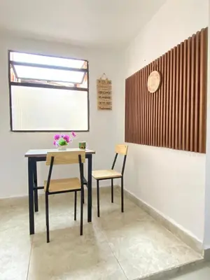 a dining room with a table and two chairs at S3 CÓMODO APARTAMENTO 3 HABI 3 BAÑOS EN LAURELES ESTADIo in Medellín
