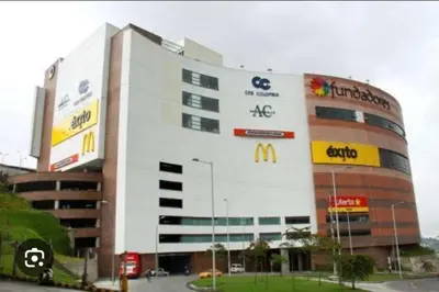 a large building with a mcdonalds sign on it at Edificio Urban Frente universidad Autónoma in Manizales