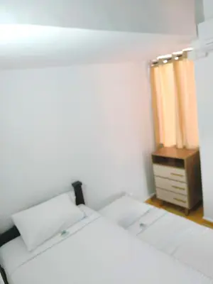 a white bedroom with a bed and a dresser at Casa Premium Las Palmas San Jeronimo in San Jerónimo