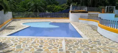 a swimming pool in a yard with a fence at Casa Premium Las Palmas San Jeronimo in San Jerónimo