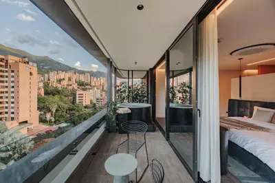 a bedroom with a view of the city at Nock - Reserved Residences in Medellín