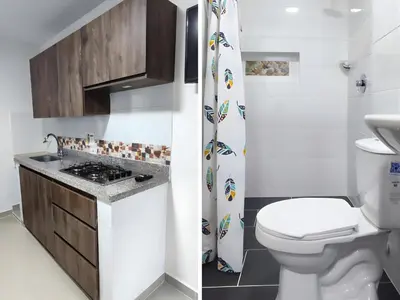 a small bathroom with a toilet and a sink at CASA ESTADIO MEDELLIN Apartamentos Turisticos renovados y modernos cerca al METRO - Barrio Laureles-Estadio in Medellín