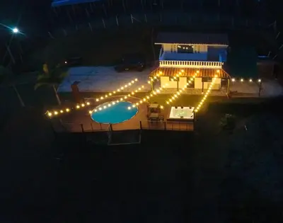 an image of a house with lights at night at Hermosa finca con vista a la piedra y embalse de Guatapé, con jacuzzi y piscina in Guatapé
