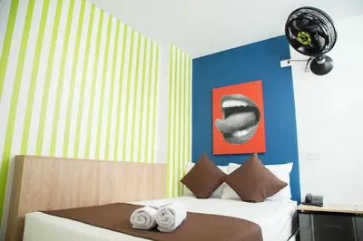 a bedroom with a bed with towels on it at Bajo la luna hotel in Medellín