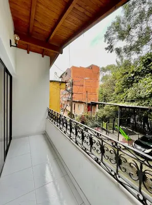 a balcony with a view of a city at Apto amplio 3 hab para familias y grupos Sabaneta in Sabaneta