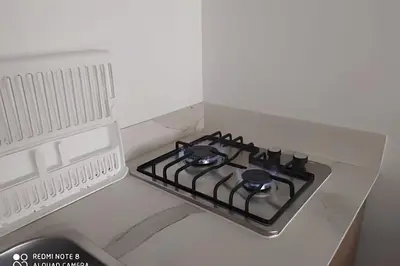 a stove in a box in a kitchen at Metro floresta acogedor apartaestudio in Medellín