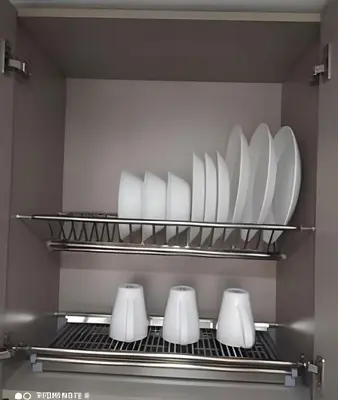 a kitchen with white plates and bowls on a shelf at Metro floresta acogedor apartaestudio in Medellín