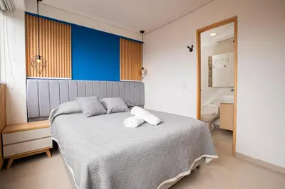 a bedroom with a bed with two towels on it at Apto con la mejor vista del Edificio in Medellín