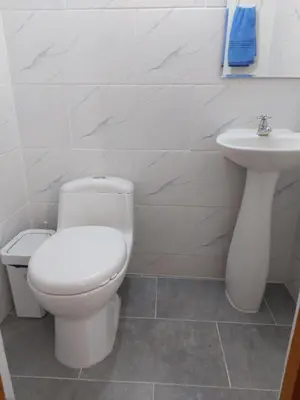 a bathroom with a toilet and a sink at Apartamento Central La Candelaria Medellín in Medellín
