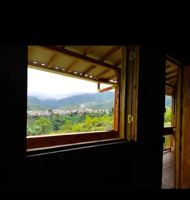 a window in a room with a view at Cabañas Lucerito Turpial in Jardin