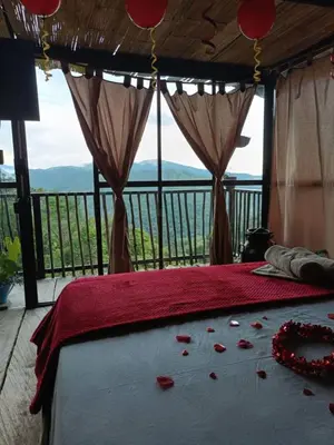 a bedroom with a bed and a balcony with a view at Cabaña la Antiguita in San Luis