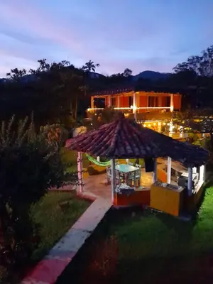 a gazebo in the yard of a house at Casa Finca Minas in Estación Angelópolis
