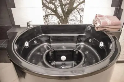 a bath tub in a bathroom with a sink at Poblado medellin cll8 101 in Medellín