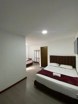 a bedroom with a large bed in a room at Hotel Gallery By 70 in Medellín