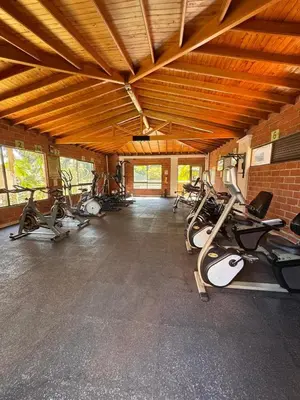a gym with several treadmills and exercise bikes at Habitacion confortable 1 persona in Medellín