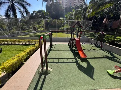 a playground with a swing set on a tennis court at Habitacion confortable 1 persona in Medellín