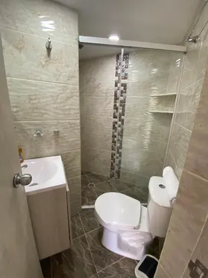 a bathroom with a toilet and a sink at Loft Céntrico en Medellín Plaza Mayor y Parking 309 in Medellín