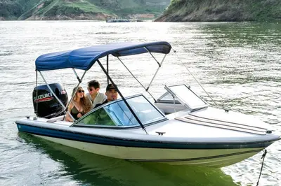a group of people in a boat on the water at Rooca Habitat Guatape in Guatapé