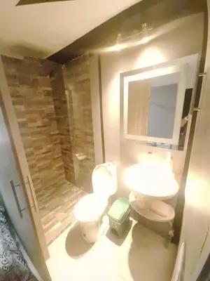 a bathroom with two toilets and a shower at Sunset Strip Suite # 301C ICON Lleras Park 301 in Medellín