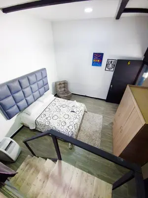 an overhead view of a room with a bed and a desk at Sunset Strip Suite # 301C ICON Lleras Park 301 in Medellín