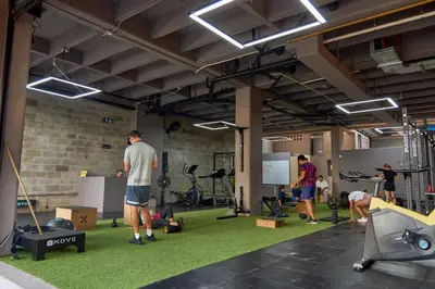 a group of people exercising in a gym at Charming Aparta-Suite Stadio Rosa Negra Retreat in Medellín