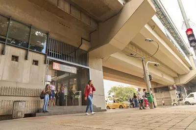 a group of people standing outside of a building at Charming Aparta-Suite Stadio Rosa Negra Retreat in Medellín
