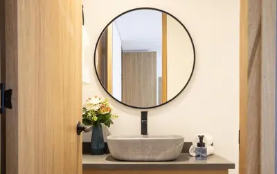 a bathroom with a sink and a mirror at Elegant Cozy Suite Rosa Negra Stadio in Medellín