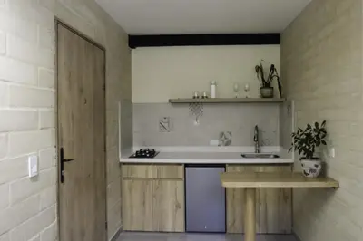 a kitchen with a sink and a counter top at Yarumo in Medellín