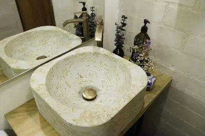 a bathroom counter with a sink and a mirror at Yarumo in Medellín