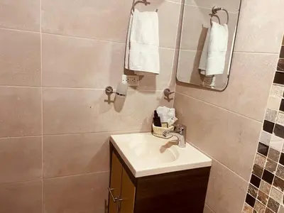 a bathroom with a sink and a mirror at Mejor alojamiento cerca Provenza 191 in Medellín
