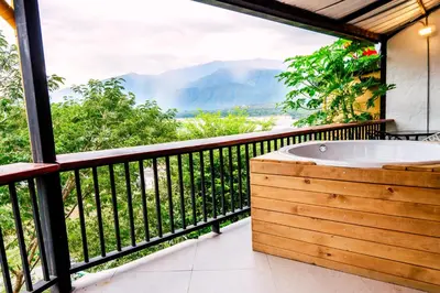 a bath tub on a balcony with a view at Casa Hotel Cautiva in Sopetran
