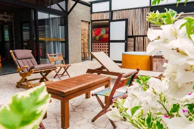 a patio with two chairs and a wooden table at Casa Hotel Cautiva in Sopetran