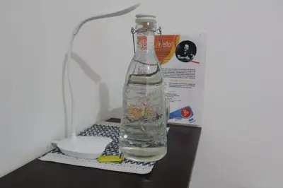 a bottle of water sitting on top of a table at Living Poblado Manila 3020 Habitación Doble in Medellín