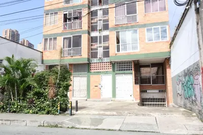 an apartment building with a white and green door at Living Poblado Manila 3020 Habitación Doble in Medellín