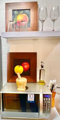 a display of wine glasses and a microwave at Apartamento amoblado en Medellin! Solo Alquiler mensual!!! in Medellín
