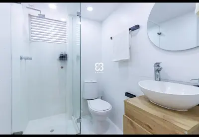 a bathroom with a sink and a toilet and a mirror at Apartamento amoblado en Medellin! Solo Alquiler mensual!!! in Medellín