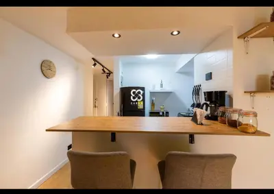 a kitchen with a wooden counter top in a room at Apartamento amoblado en Medellin! Solo Alquiler mensual!!! in Medellín