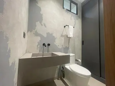 a bathroom with a toilet and a sink at Casa Tokyo 4 Manila - Terraza By Xcay Home in Medellín