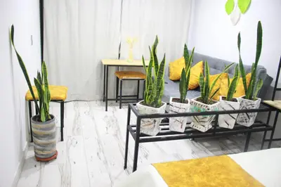 a living room with potted plants and a couch at Cómodo loft en Medellín in Medellín